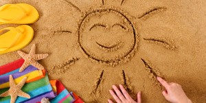 Beach with smiling sun